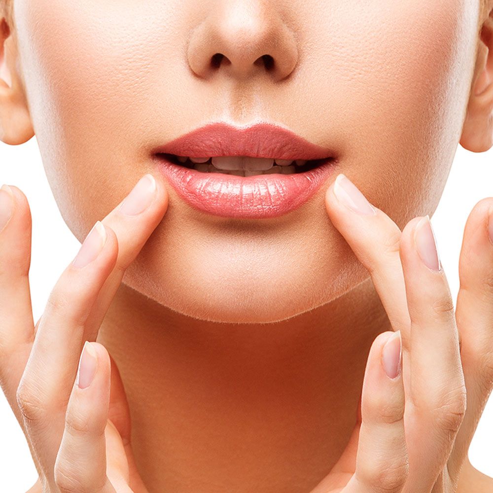 Woman full lips after lip augmentation