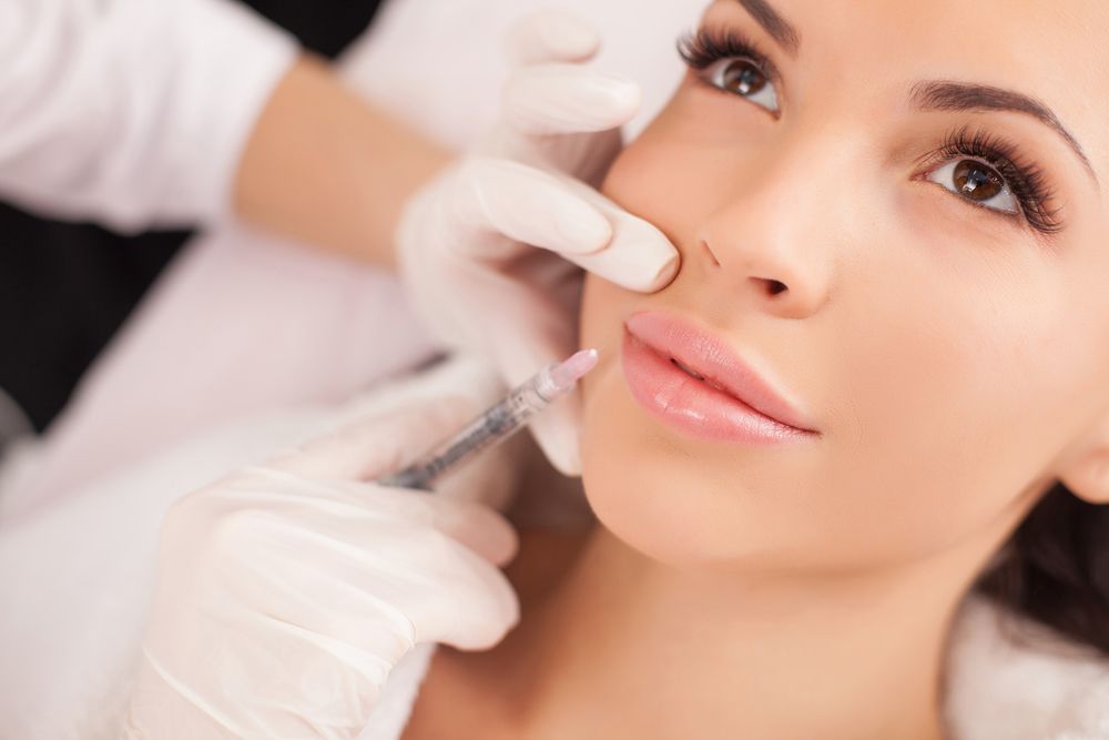 Woman receiving lip injectable